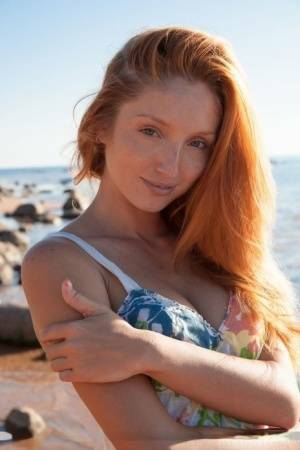 Hot redhead Michelle H flaunting her big tits & tight pussy on the beach on fanspics.net