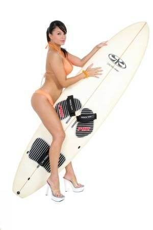 Sexy surfer girl Sarah peels off her bikini to model naked on her board on fanspics.net