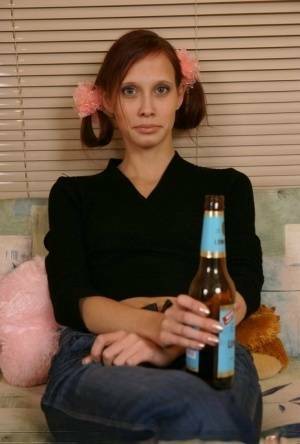 Young redhead chugs a beer before having sex with an older man on fanspics.net