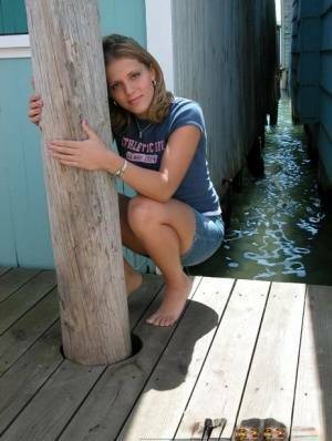 Blonde solo girl flashes upskirt panties on lakeside boardwalk on fanspics.net