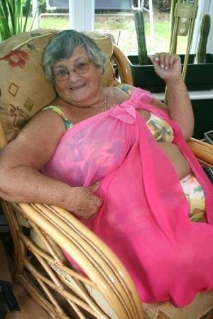 Horny old granny in glasses disrobes to reveal huge saggy tits & big BBW ass on fanspics.net