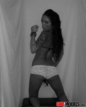 Teen pulls down her white lace panties to show off her tight teen ass on fanspics.net