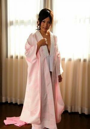 Japanese solo girl slips off her robe to reveal her nice boobs in white socks - Japan on fanspics.net