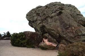 Amateur chick poses totally nude in running shoes near huge boulders on fanspics.net