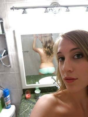 Smiley amateur Cadence Lux stripping and picturing herself in the bath on fanspics.net