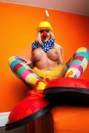 Hot cosplay MILF Leya Falcon in clown costume fondling her huge big tits on fanspics.net