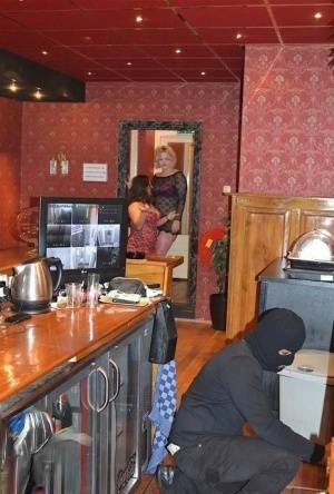 Amateur chick Kimberly Scott and a girlfriend disrobe a hooded male robber on fanspics.net