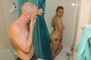 Naked girl Nadia White pleasures her guy's cock while taking a shower on fanspics.net