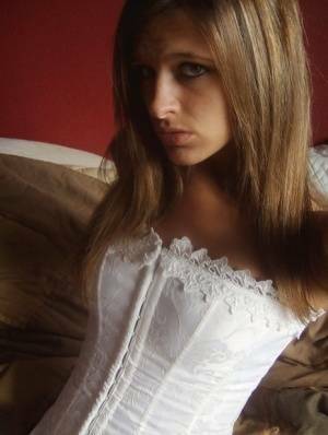 Teen in white corset and tight panties showing off her perfect tight body on fanspics.net