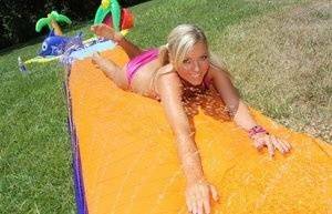 Young blonde Ally Kay ends a water fight by having sex in backyard on fanspics.net