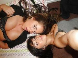 Teen lesbians April Oneil and Ella Milano humping and undressing each other on fanspics.net