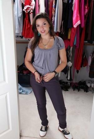 Sweet teenage amateur undressing and spreading her legs in changing room on fanspics.net