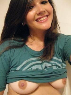 Cutie Veronica takes a slef shot of her nice big tits and firm round ass on fanspics.net