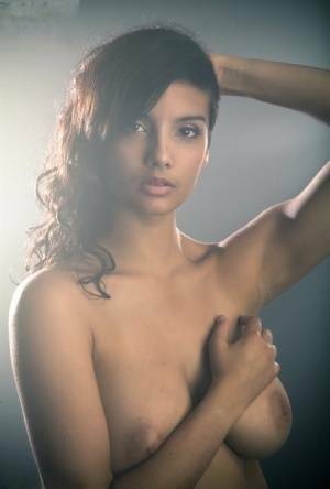 Beautiful Desi female removes her dress to expose her big natural boobs on fanspics.net