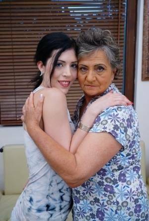 Lesbian granny worshipping sexy teen's attractive body and holes on fanspics.net