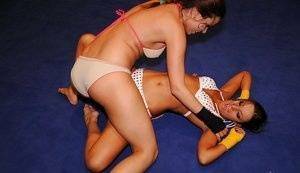 Adorable lesbians are into hot nude wrestling in the ring on fanspics.net