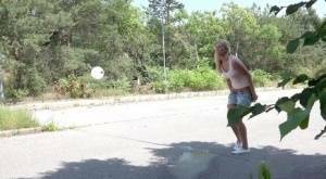 Blonde female Nikki Dream can't hold her pee any longer and squats on roadway on fanspics.net