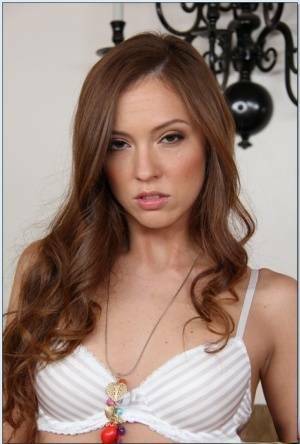 Pretty babe Maddy O'Reilly stripping and exposing her shaved slit on fanspics.net