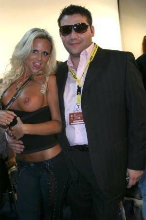 Blonde MILF Silvia Saint fully clothed posing & flaunting big tits at party on fanspics.net