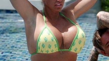 Katie Price Shows Off Her Bikini Body While Relaxing by the Pool with Carl Woods on fanspics.net