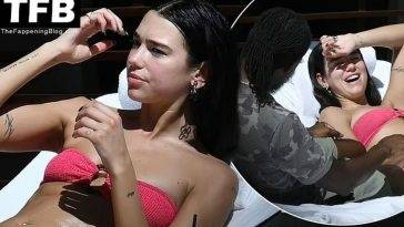 Dua Lipa Wears a Hot Pink Bikini as She Relaxes by the Pool with a Mystery Man in Miami on fanspics.net