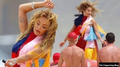 Rita Ora Wears a Bright Dress as She Does a Sexy Shoot at Maroubra Beach on fanspics.net