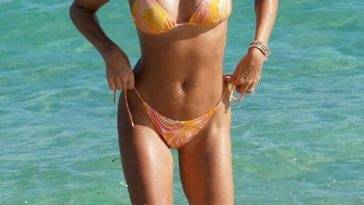 Sylvie Meis Rocks a Skimpy Orange Bikini at the Beach in Miami on fanspics.net