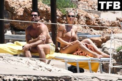 Michelle Hunziker & Giovanni Angiolini Relax on the Beach of Their Hotel in Sardinia on fanspics.net