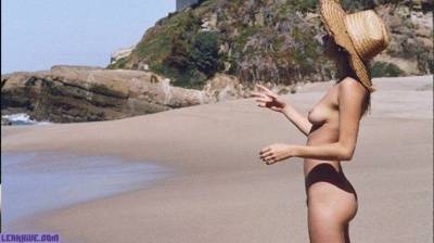 Camille Rowe nude on the beach on fanspics.net