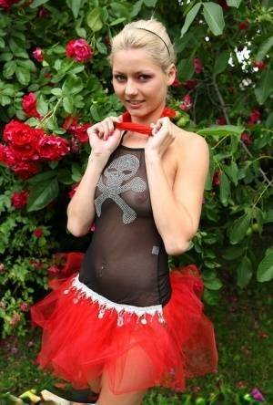 Cute blonde teen Buffy hikes up a tutu before masturbating in the back yard on fanspics.net