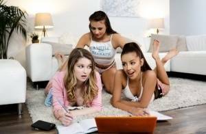 Young girls get busy with a lesbian threesome on a sofa ensemble on fanspics.net