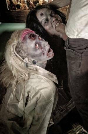 Fetish models Brittany Lynn and Jessie Lee giving head in Zombie threesome on fanspics.net