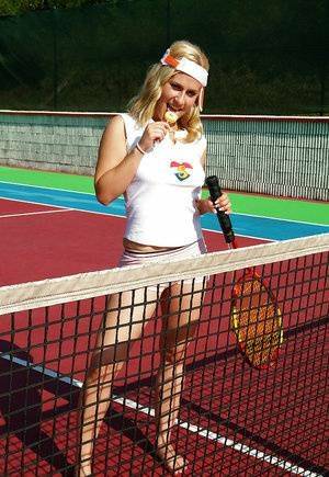 Sporty babe with big tits Angel B toying her cunt on the tennis court on fanspics.net