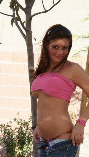 Amateur chick Kate Crush sets her perky tits free outdoors in denim jeans on fanspics.net