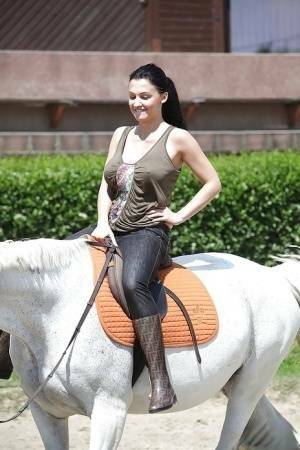 Pornstar Aletta Ocean is riding a horse outdoor in glasses on fanspics.net