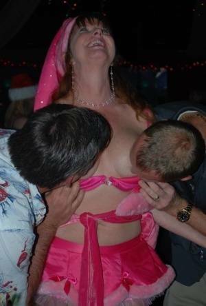 Mature lady Dee Delmar and friends hit the swing club for Christmas orgy on fanspics.net