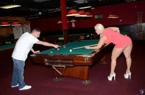 Curvy slut gets nailed on a pool table and jizzed over her big jugs on fanspics.net