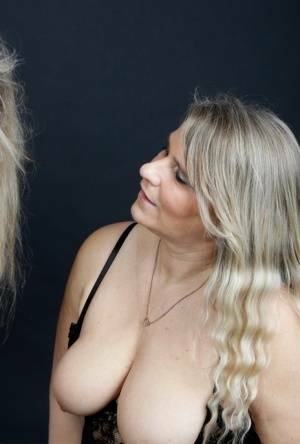 Older blonde Sweet Susi and her girlfriend take turns sucking on a penis on fanspics.net