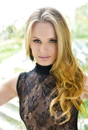 Blonde babe model Jillian Janson strutting outdoors in black bodystocking on fanspics.net