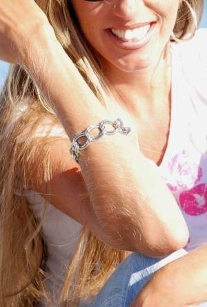 Amateur model Lori Anderson shows off her hairy arms while fully clothed on fanspics.net