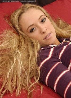 Blonde amateur Amber uncups A-cups tits before fingering her naked pussy on fanspics.net