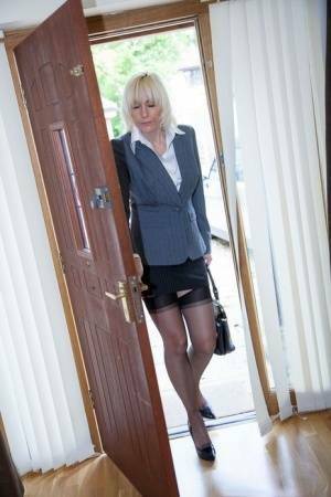 Older MILF Jan Burton strips off business clothes after a hard day at office on fanspics.net