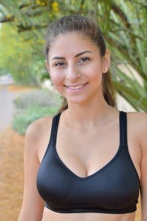 Teen jogger pauses to take off her spandex pants and bra on a run on fanspics.net