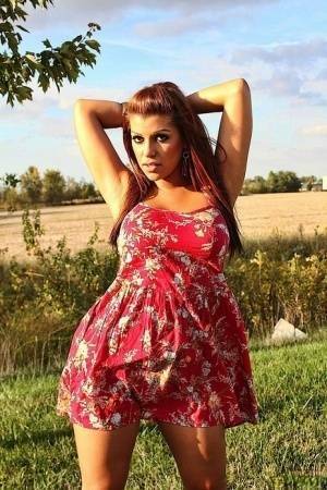 Amateur solo girl Briana Lee flashes her tits and twat in the countryside on fanspics.net