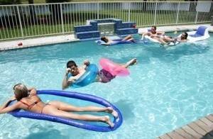 Frolic girls in bikini flashing their tits at the pool party on fanspics.net