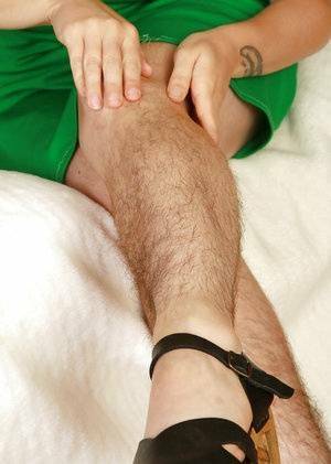 Redhead mature slut with hairy legs and private parts stripping down on fanspics.net