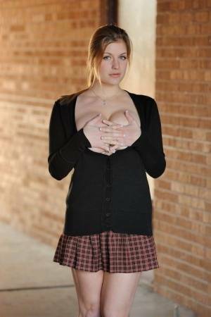 Amateur abbe letting big natural schoolgirl tits loose outdoors in socks on fanspics.net