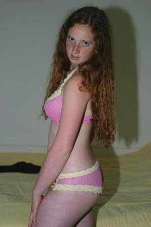 Flexible redhead Rachel showcases her natural pussy after lingerie removal on fanspics.net