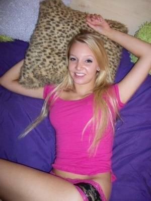 Cute teen girl with blonde hair shows off her tits and twat for the first time on fanspics.net