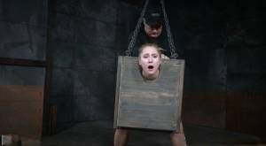 Blonde girl Odette Delacroix is made to suck a black cock with head in stocks on fanspics.net